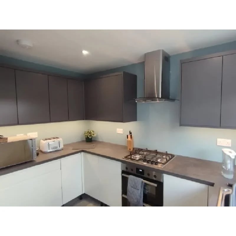 Kitchen renovation electrics — chimney extractor, downlighting and worktop sockets wired to current regulations.
